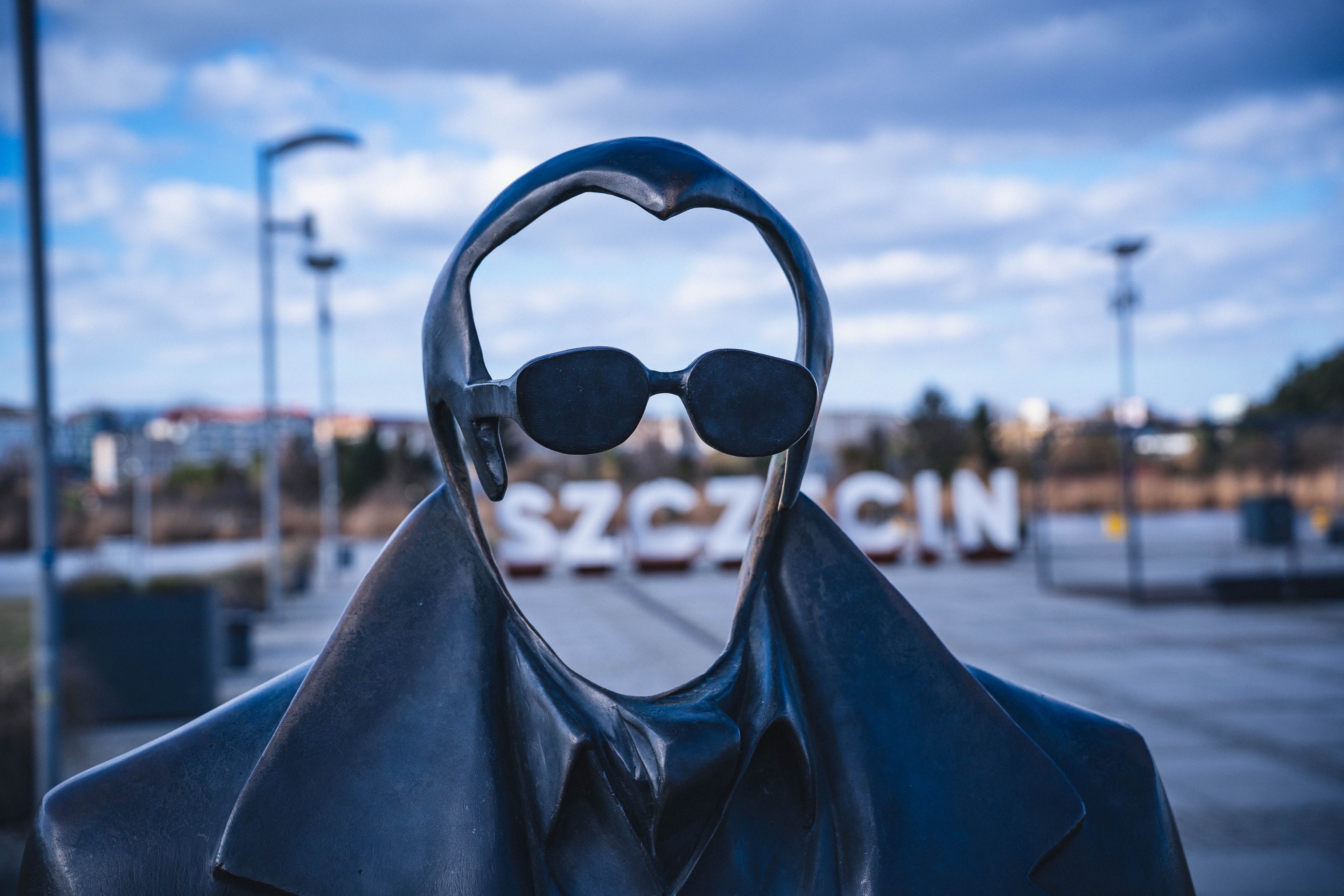 Sigma 20-200mm sample photo at 52mm showing sculpture with blurred background